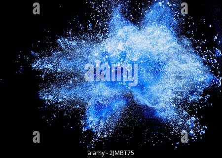 Blue powder explosion on black background. Stock Photo