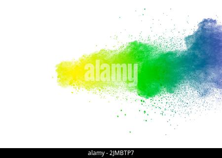 Colorful powder explosion on white background.Abstract blue yellow green  color dust particles splas Stock Photo