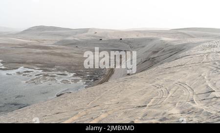 qatar adventurous place khor al udeid ,sea line area filled with many dunes. qatar dunes Stock Photo