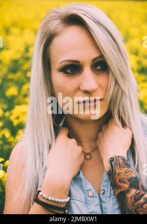 Vintage style portrait of a young blond woman Stock Photo
