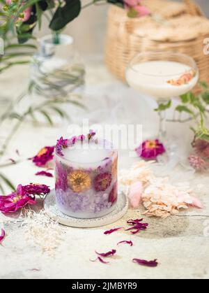 Handmade candles of a unique design, with different flowers, dry