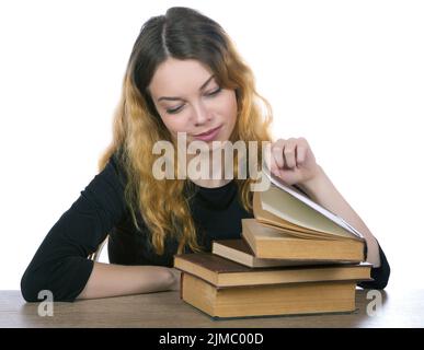 Girl looking old books and smiling isolated on white background Stock Photo