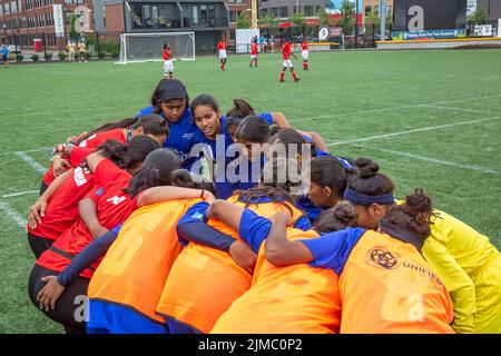 Detroit, Michigan - The women's teams of India and Namibia meet in the Special Olympics Unified Cup football (soccer) tournament. The Unified Cup pair Stock Photo