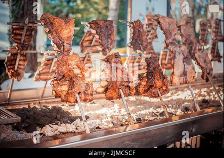 Traditional Argentinian asado roasted lamb grilled meat. Stock Photo