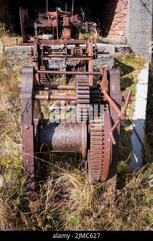 Rusty gears and winch mechanism.  Old machinery. Stock Photo