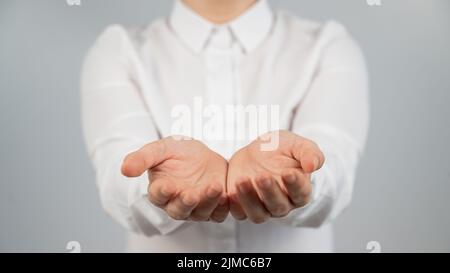 Close-up of female hands with palms up.  Stock Photo