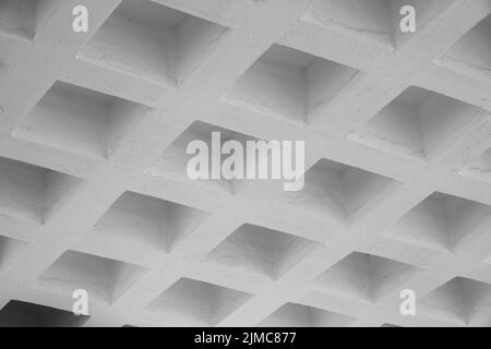 plain and white abstract wallpaper details with squares, geometric figures, ceiling design Stock Photo