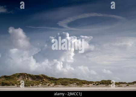 Cloud formations over the dunes on the island of Terschelling Stock Photo