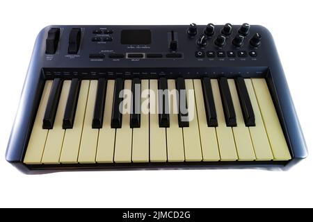 USB MIDI Synthesizer Keyboard Controller  on white background Stock Photo