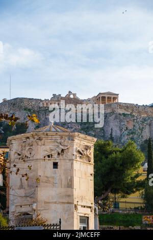 Tower of the Wind-gods in Roman Agora and Acropolis in the background Stock Photo