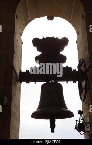 backlighting of a bell in a church steeple in Spain Stock Photo
