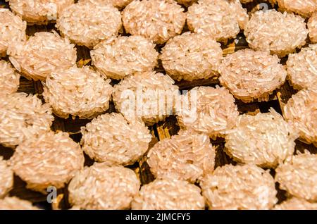 Thai Rice cakes drying in the sun Stock Photo