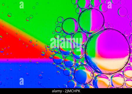 Abstract Background of Oil Bubbles on Water Surface colorful palette. Stock Photo