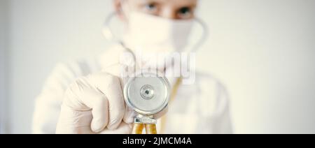 Female doctor holding a stethoscope Stock Photo
