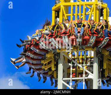 Crange, Herne, NRW, 05th Aug, 2022. People on the 85 metre high 'Hangover - The Tower' ride. The official opening day of the 2022 Cranger Kirmes, Germany's 3rd largest funfair and the largest of its kind in NRW, sees thousands of visitors enjoying the carousels, roller coasters, beer halls, food stalls and other attractions. The popular fair, which was paused during the pandemic, regularly attracts more than 4m visitors during its 10 day run and has been established for decades in its current form, with the fair itself dating back to the early 18th century at Crange. Credit: Imageplotter/Alamy Stock Photo