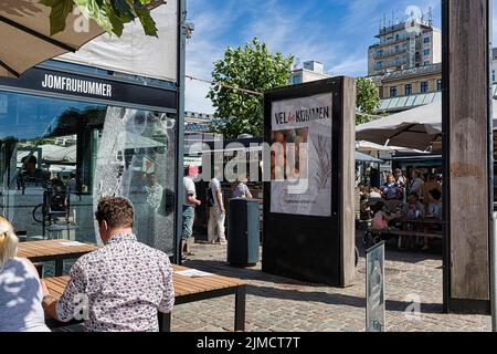 Visitors in front of the Torvehallerne market hall with street food and specialities, welcome sign, Norrebro district, Norrebro, Copenhagen, Denmark Stock Photo