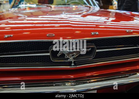 Bonnet of historic classic sports car classic car Ford Mustang with radiator grille and emblem of horse, fair Techno Classica, Essen, North Stock Photo