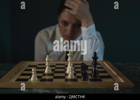 Symbol image, desperation, success, confusion, strategy, woman with a chess set Stock Photo