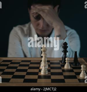 Symbol image, desperation, success, confusion, strategy, woman with a chess set Stock Photo