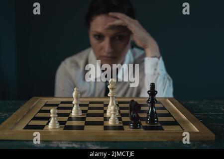 Symbol image, desperation, success, confusion, strategy, woman with a chess set Stock Photo