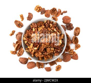 Walnuts in white bowl isolated on white background Stock Photo