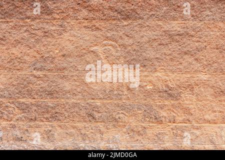 Barely visible goat petroglyphs carved on rock wall of Buckskin Gulch canyon in Utah, USA Stock Photo