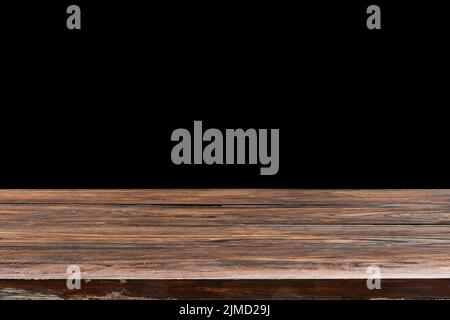 Oaken table from wooden planks on a black background for display or present your products. Stock Photo