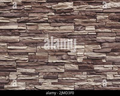 Dark beige and brown slate stone wall texture Stock Photo