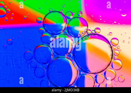 Abstract Background of Oil Bubbles on Water Surface colorful palette. Stock Photo