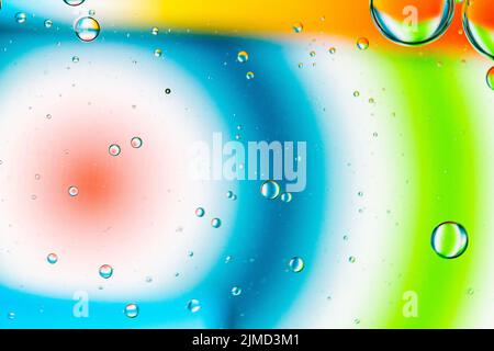 Abstract Background of Oil Bubbles on Water Surface colorful palette. Stock Photo