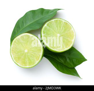 Sliced Limes With Green Leaves Isolated Stock Photo