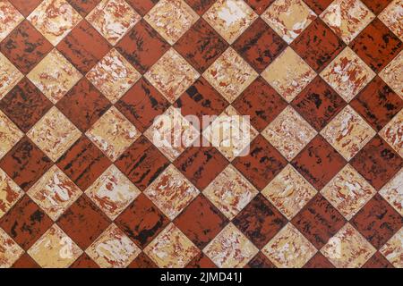 Old fashioned antique brown beige floor tiles Stock Photo