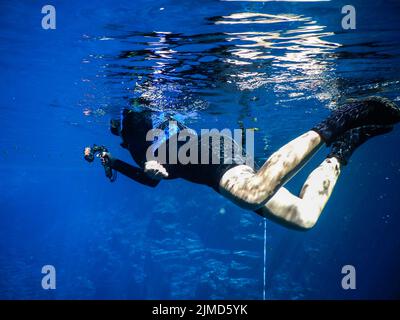 Practicing diving and snorkeling, mysterious lagoon, beautiful lagoon of transparent turquoise blue Stock Photo