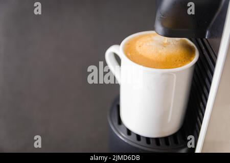 Coffee maker serving coffee, espresso, coffee pod. Stock Photo