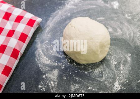 Preparation of pizza dough, dough resting. Stock Photo