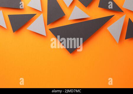 Black And Gray Triangular Shapes On Orange Stock Photo