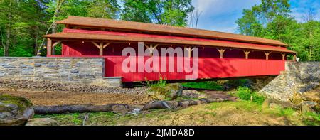 Close Up View of a Restored Old 1844 Covered Bridge on a Sunny Day Stock Photo