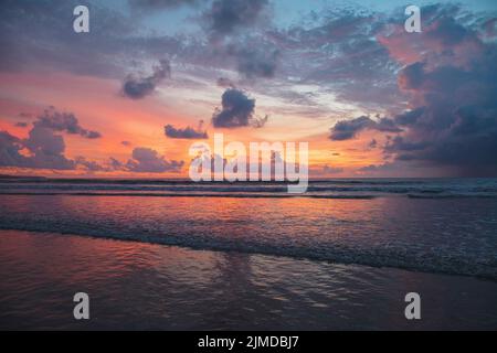 Gorgeous fiery red sunset view on Kuta beach Stock Photo