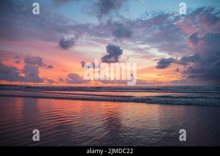 Fiery red sunset view on Kuta beach Stock Photo