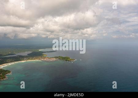Aerial view of coastline with a beach and hotels among palm trees. Sri Lanka. Stock Photo
