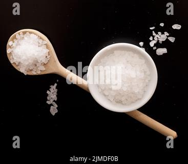 Salt on black Stock Photo