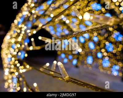 Selective focus on LED Christmas lights. Magical New Year's lighting. Stock Photo