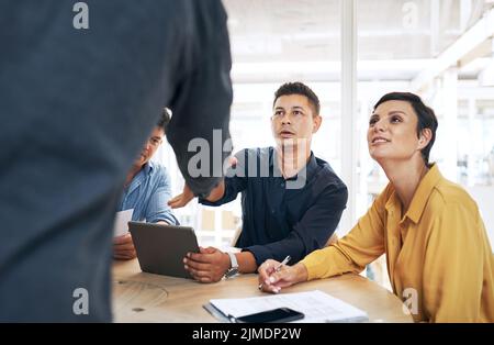 I never thought Id actually get to meet you. businesspeople shaking hands during a meeting in an office. Stock Photo