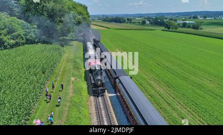 Antique Restored Steam Locomotive Blowing Smoke and Steam Stock Photo