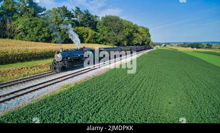 Antique Restored Steam Locomotive Blowing Smoke and Steam Stock Photo