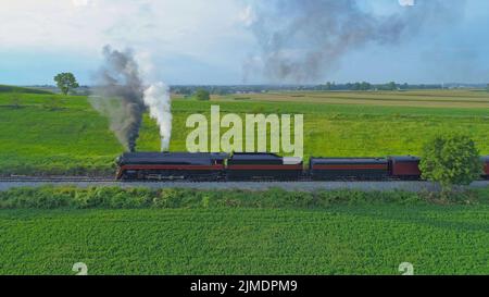 Antique Restored Steam Locomotive Blowing Smoke and Steam Stock Photo