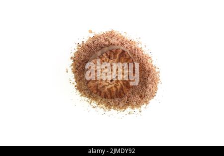Nutmeg is the spice made by grinding the seeds kernels of the fragrant nutmeg tree, Myristica fragrans, and used in many savory and sweet dishes Stock Photo