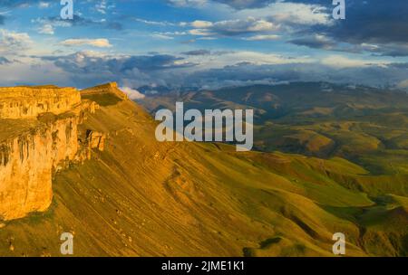 Plateau Bermamyt and hills at sunset Stock Photo