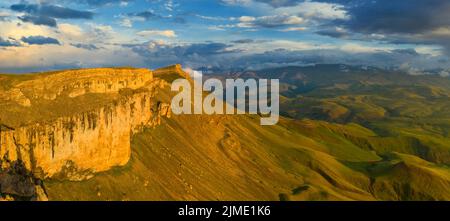 Plateau Bermamyt and hills at sunset Stock Photo