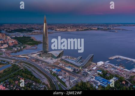 Russia, St.Petersburg, 16 May 2021: Drone point of view of highest skyscraper in Europe Lakhta Center at pink sunset, Headquarte Stock Photo